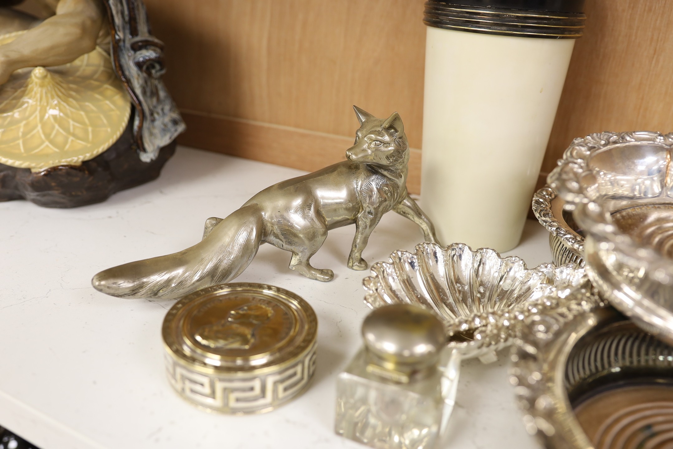 Three silver plated wine coasters, a pair of shell butter dishes, fox, ink well and a cocktail shaker